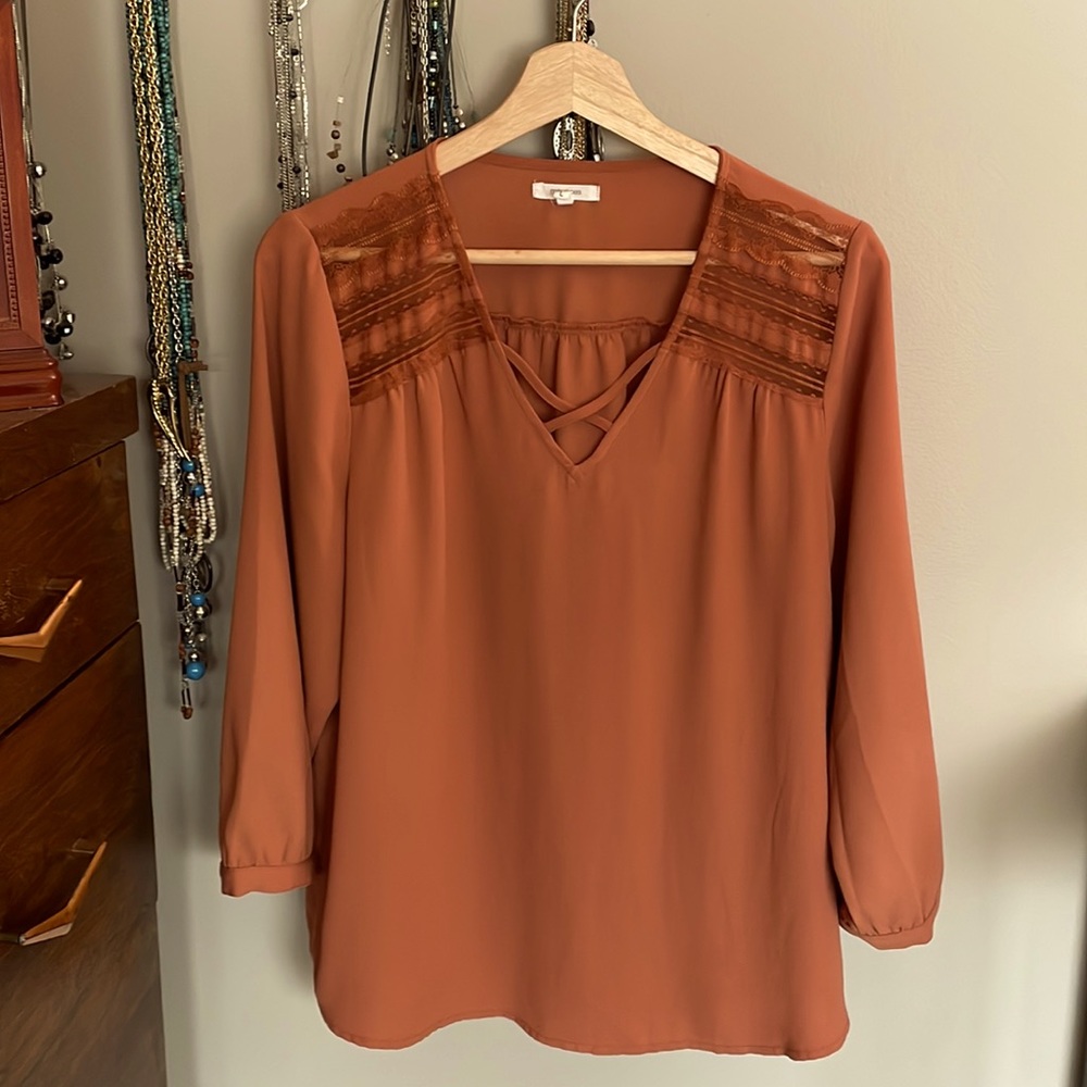 This comfy top is perfect for “pumpkin spice” season! Flowy Lace embellishments.